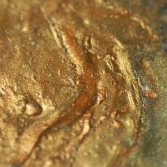 Gold yellow orange extremely detailed painting close-up with lumps
