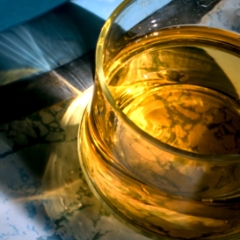 Apple juice with sunbeams shining through it