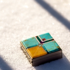 Tiny blue box in snow