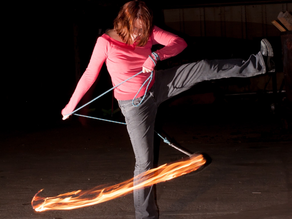 Fire Spinners photograph. See the <a href='/technology/rear-sync-flash-photography/'>full explanation of rear-curtain flash.</a>