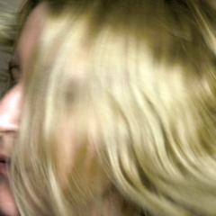 Flippy hair, head turned right, lots of hair