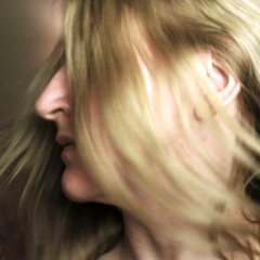 Flippy hair, face not shown, head turned right
