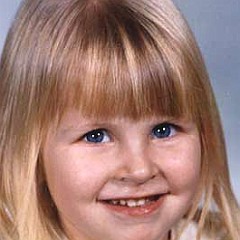 1975 wearing a ruffled collar like the queen of kindergarten