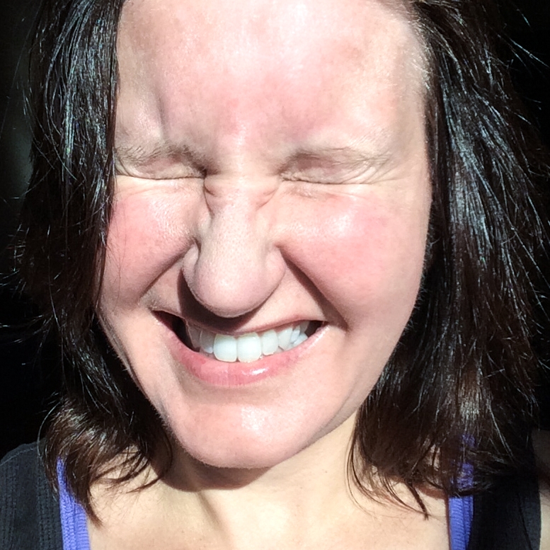 Self portraits photograph. Goofing around in the sun. I kept my hair dark brown back then.