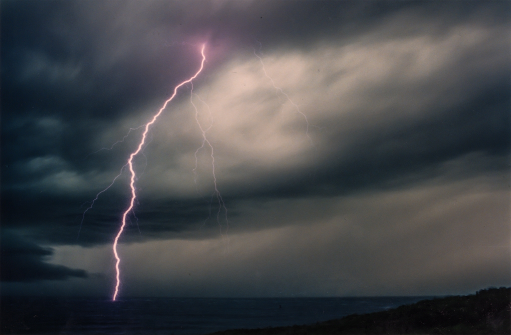 Road trip across America photograph. I left my shutter open until the lightning struck. This photo is very old, from before the time of digital cameras.